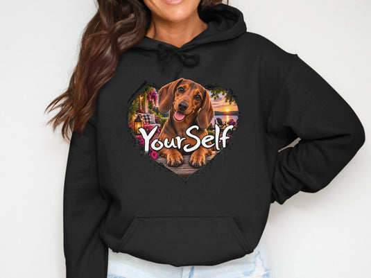 Black hoodie with heart-shaped graphic of dachshund and 