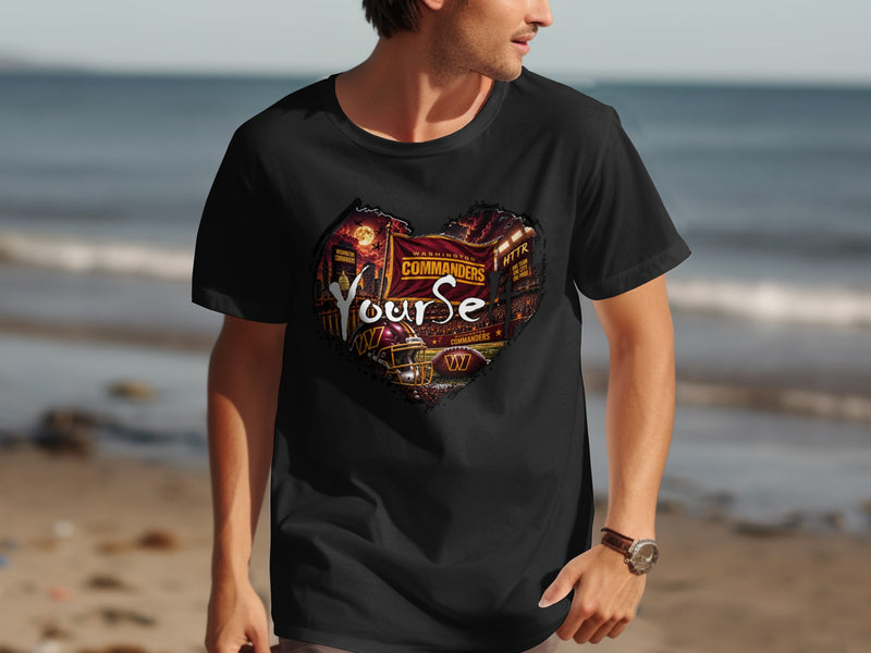 Load image into Gallery viewer, Washington Commanders heart graphic t-shirt with football helmet and stadium scene.
