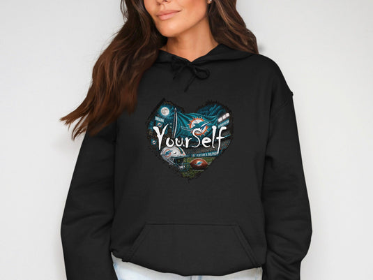Black hoodie with heart graphic featuring Miami Dolphins logo, football, and text.