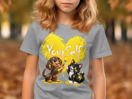 Grey t-shirt with a cartoon dog and cat painting a yellow heart that says "Your Self".