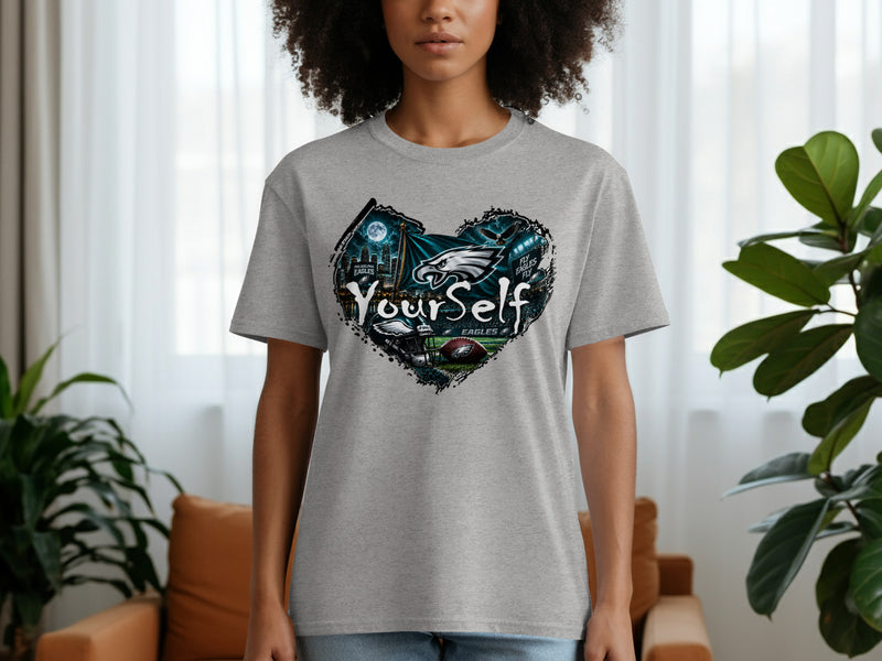 Load image into Gallery viewer, Grey t-shirt with a heart design featuring Philadelphia Eagles logo and cityscape.
