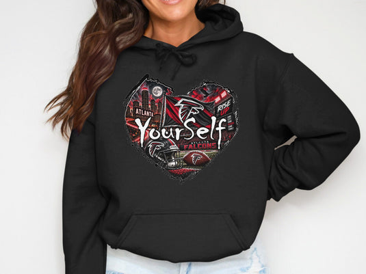 Black hoodie with Atlanta Falcons heart design featuring city, stadium, and "Rise Up" text.