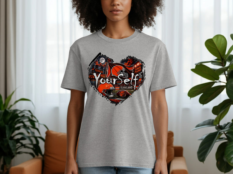 Load image into Gallery viewer, Gray t-shirt with a heart-shaped graphic featuring Cleveland Browns football imagery and text.
