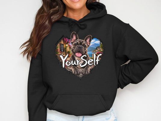 Black hoodie with a French bulldog peeking through a heart-shaped graphic.
