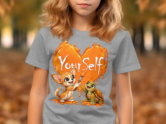 Grey t-shirt with illustration of dog and turtle painting an orange heart with text "Yourself".
