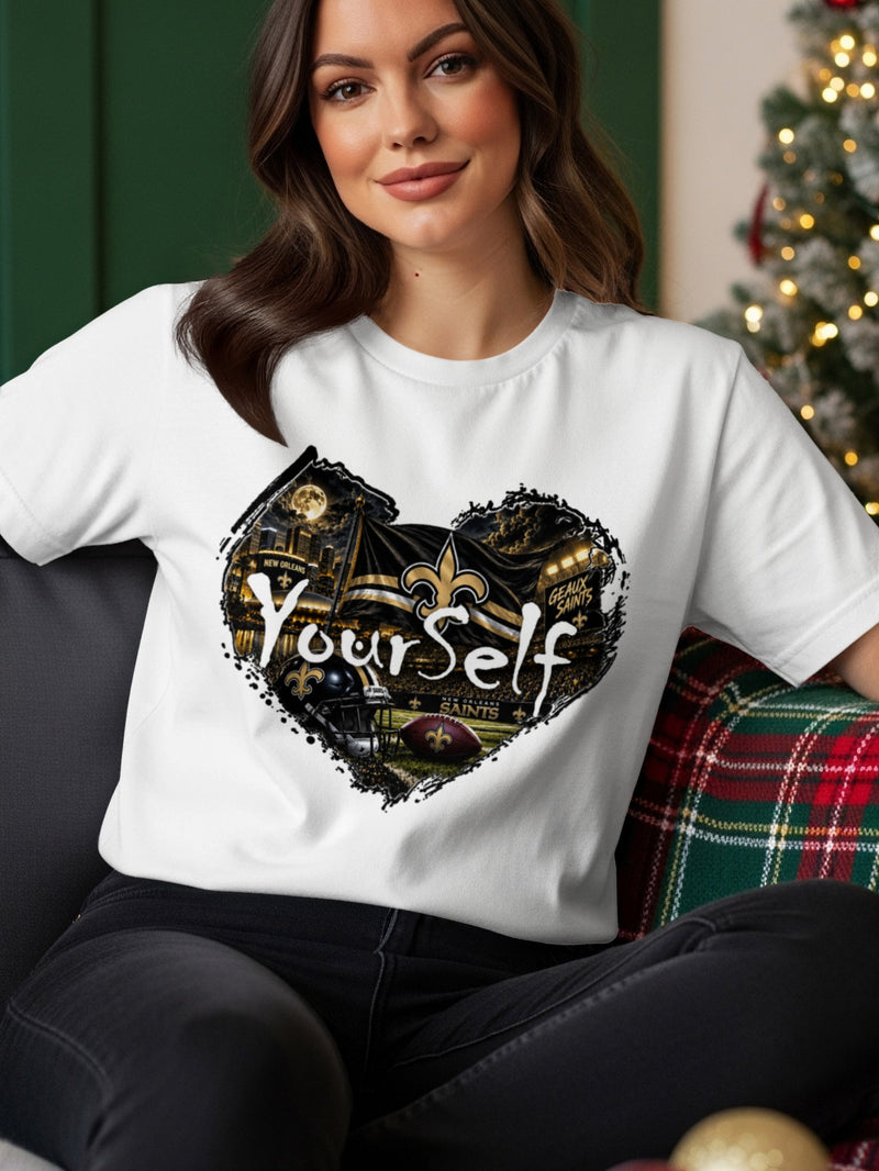 Load image into Gallery viewer, New Orleans Saints football helmet, ball, stadium, and flag design on white t-shirt.
