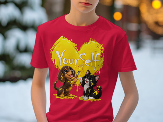 Red t-shirt with a yellow heart graphic and a dog painting a cat.