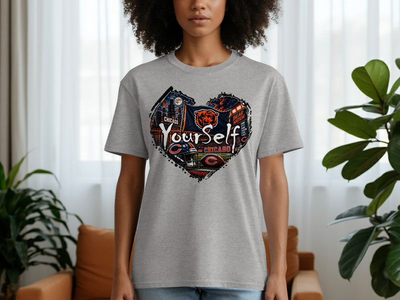 Load image into Gallery viewer, Grey t-shirt with a heart shape graphic featuring Chicago skyline, Bears logo, and football elements.

