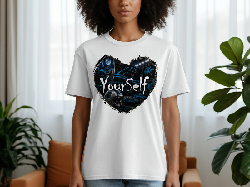 Load image into Gallery viewer, White t-shirt featuring a heart graphic with Carolina Panthers logo and football imagery.
