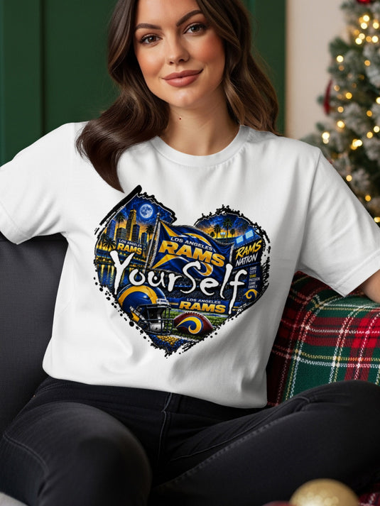 White t-shirt with a heart-shaped graphic featuring Los Angeles Rams football imagery.