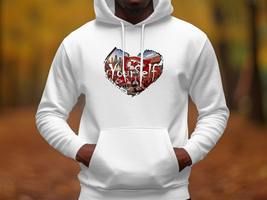 White hoodie featuring a heart-shaped graphic with Chiefs football elements and the word 