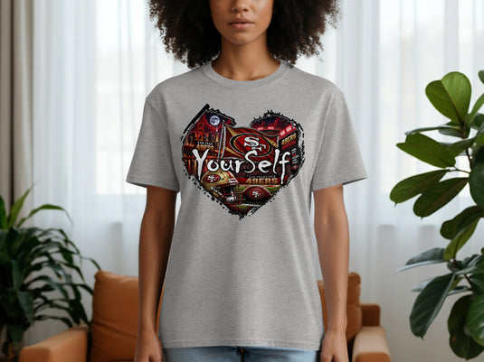 Grey t-shirt with a heart-shaped graphic featuring San Francisco 49ers logos, stadium, and 