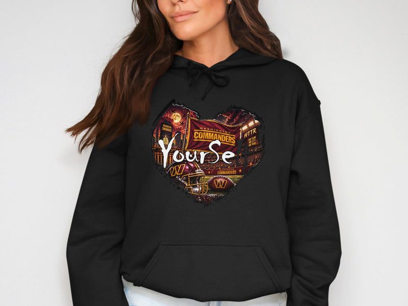 Load image into Gallery viewer, Black hoodie with heart-shaped Washington Commanders graphic featuring stadium and football elements.
