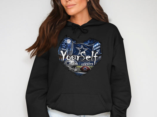 Dallas Cowboys heart graphic with football, helmet, flag, and stadium on black hoodie.
