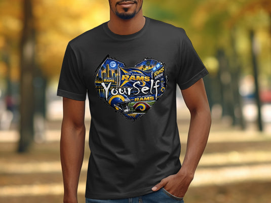 Los Angeles Rams heart graphic with football helmet and city skyline on black t-shirt.