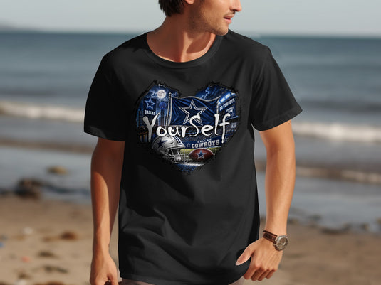 Black t-shirt with heart-shaped Dallas Cowboys graphic featuring stadium, flag, and football.