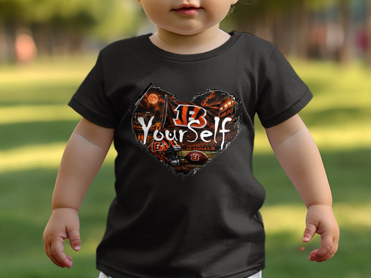 Toddler wearing a black t-shirt with a heart-shaped Cincinnati Bengals graphic.