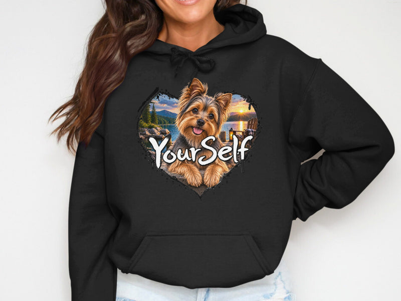 Load image into Gallery viewer, Black hoodie with heart graphic of a Yorkshire Terrier on a lake dock at sunset, text "YourSelf".
