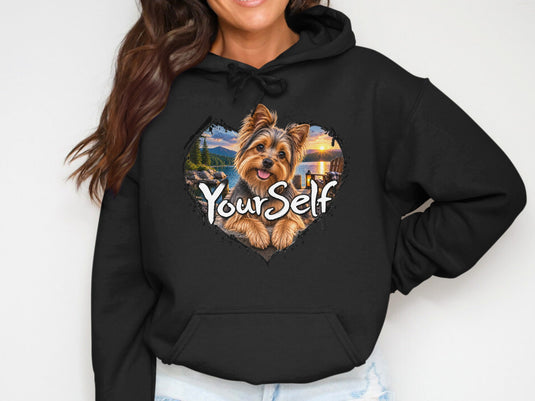 Black hoodie with heart graphic of a Yorkshire Terrier on a lake dock at sunset, text 